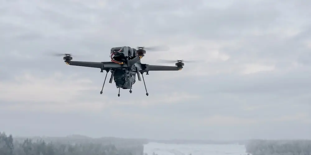 Drone operating above snowy terrain
